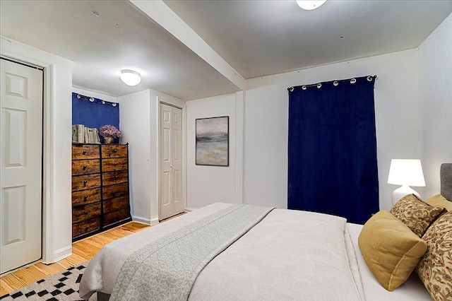 bedroom featuring light wood finished floors