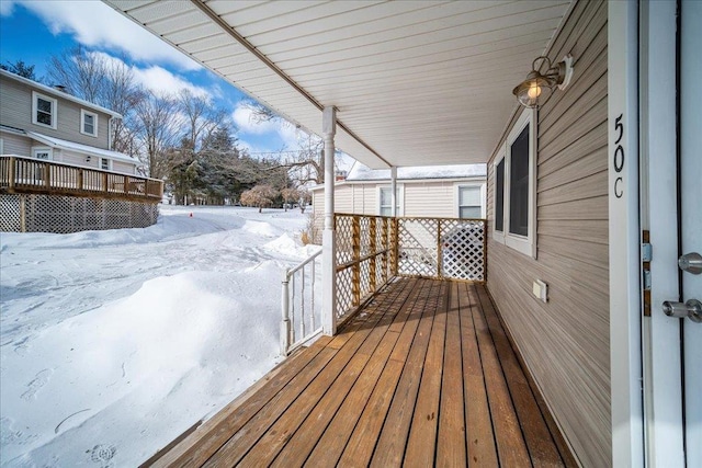 view of snow covered deck