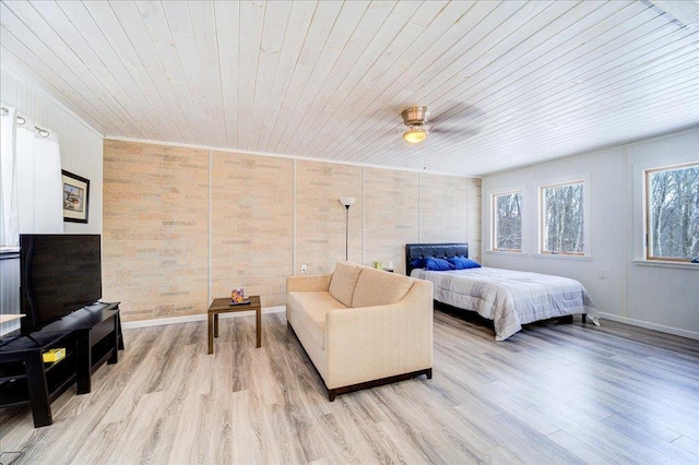 bedroom featuring light wood-style floors, wood ceiling, ceiling fan, and baseboards