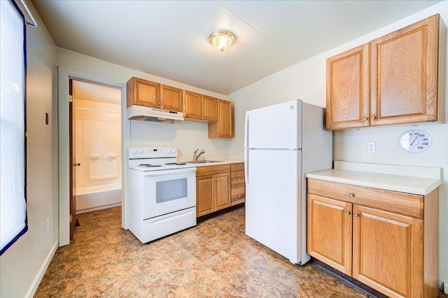 kitchen with white appliances, under cabinet range hood, light countertops, and a sink