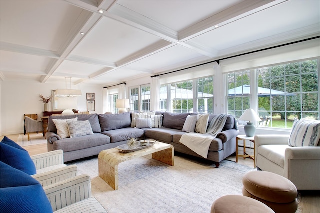 interior space with beamed ceiling, plenty of natural light, coffered ceiling, and light wood-style floors