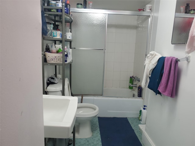15 Roberts St, Middletown, NY 10940 - bathroom with bath / shower combo with glass door, toilet, and a sink