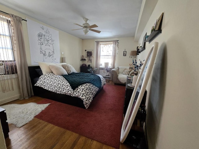 bedroom featuring a ceiling fan and wood finished floors