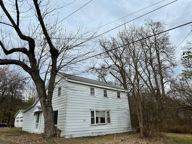 view of side of property featuring a garage