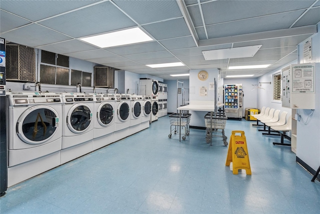 shared laundry area with tile patterned floors and washing machine and dryer