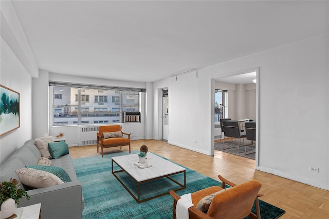 living room with radiator heating unit and baseboards