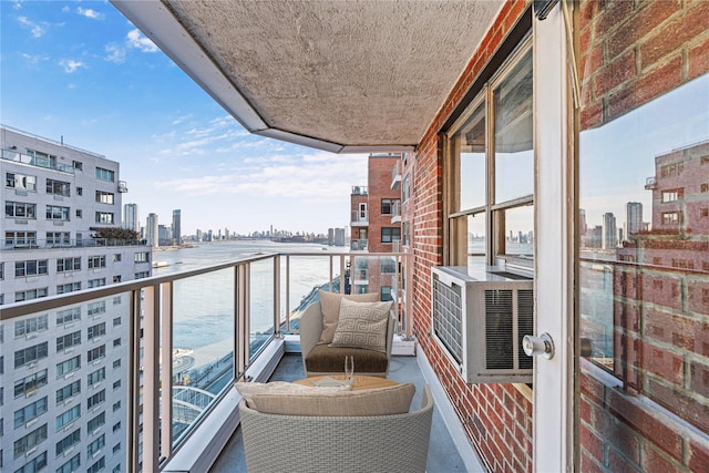 balcony with a view of city and a water view