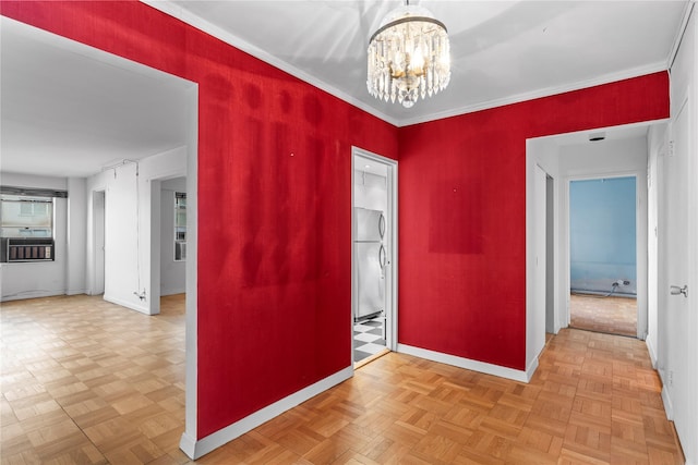 unfurnished room with baseboards, an inviting chandelier, and ornamental molding