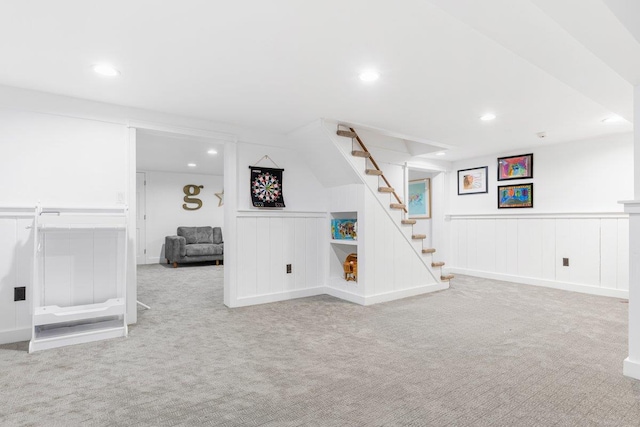 below grade area with stairway, recessed lighting, and carpet floors