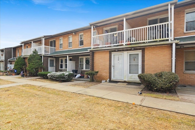 view of front of home with brick siding