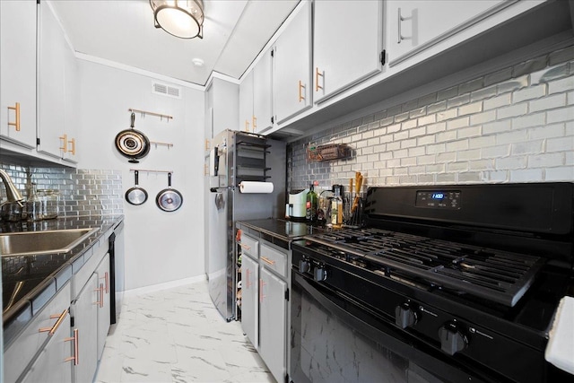 kitchen with black range with gas cooktop, a sink, baseboards, marble finish floor, and dark countertops