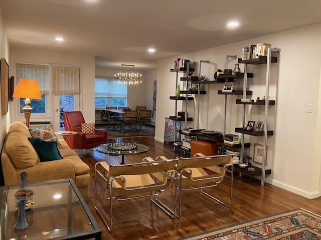 20 Chapel Pl Unit 2K, Great Neck, NY 11021 - living room featuring wood finished floors, recessed lighting, and a chandelier