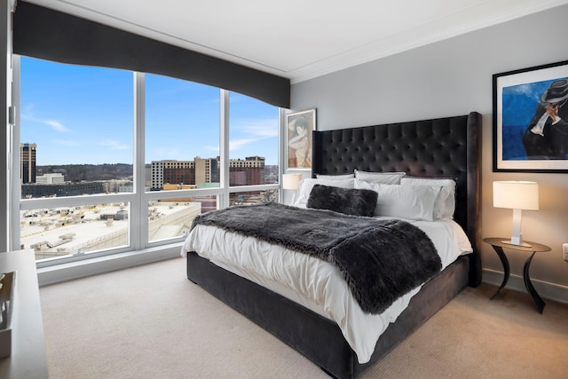 carpeted bedroom with a view of city, ornamental molding, and baseboards