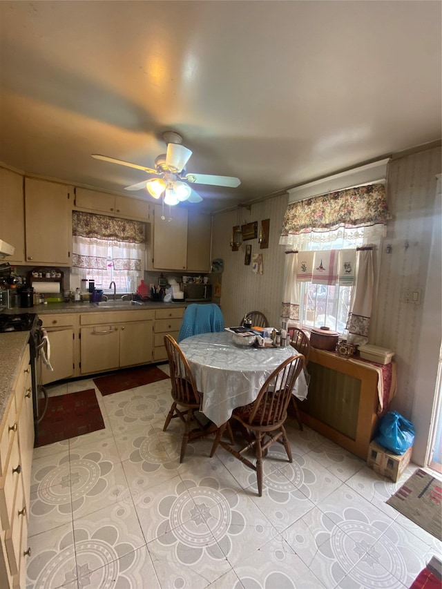 dining room featuring light tile patterned floors, a ceiling fan, and a wealth of natural light