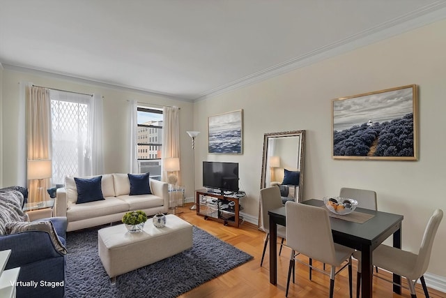 living room featuring crown molding and baseboards