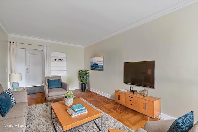 living area with baseboards and crown molding