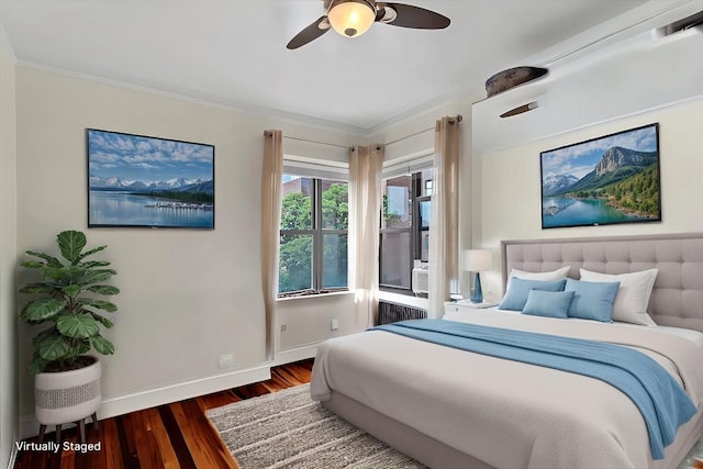 bedroom featuring a ceiling fan, wood finished floors, baseboards, radiator heating unit, and ornamental molding