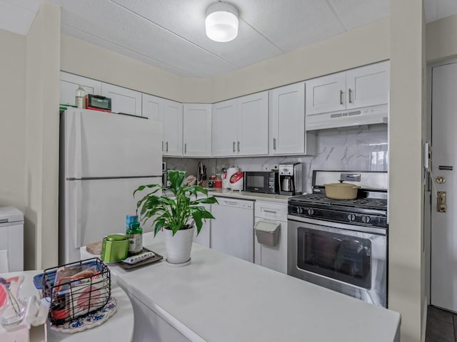 kitchen with light countertops, white appliances, white cabinetry, and under cabinet range hood