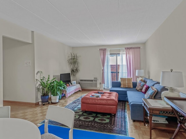 living area featuring baseboards