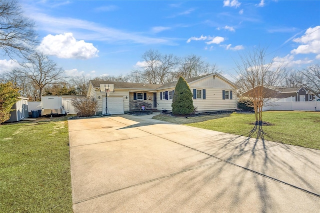 ranch-style home with concrete driveway, an attached garage, fence, board and batten siding, and a front yard