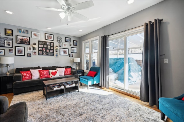 living room with ceiling fan, wood finished floors, and recessed lighting