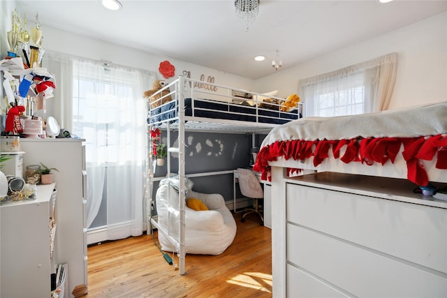 bedroom with light wood-type flooring and recessed lighting