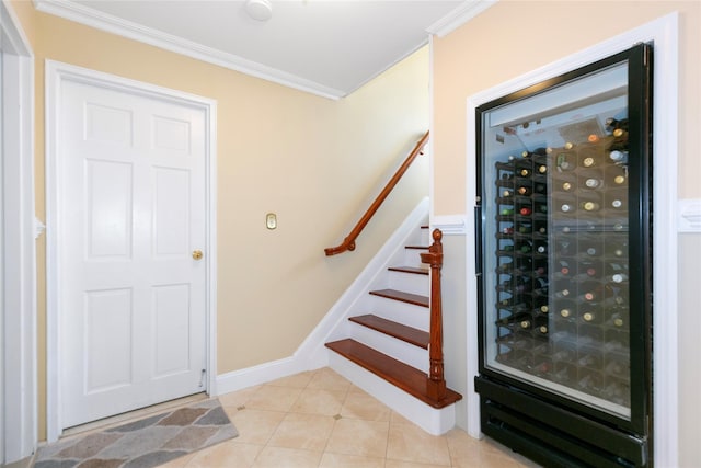 wine cellar with light tile patterned floors, baseboards, electric panel, and ornamental molding