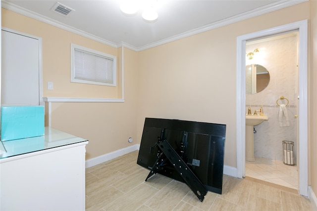 interior details with visible vents, crown molding, and baseboards