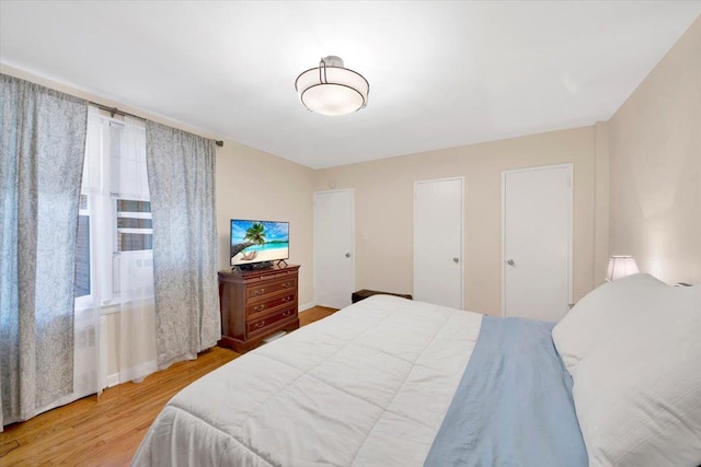 bedroom with wood finished floors