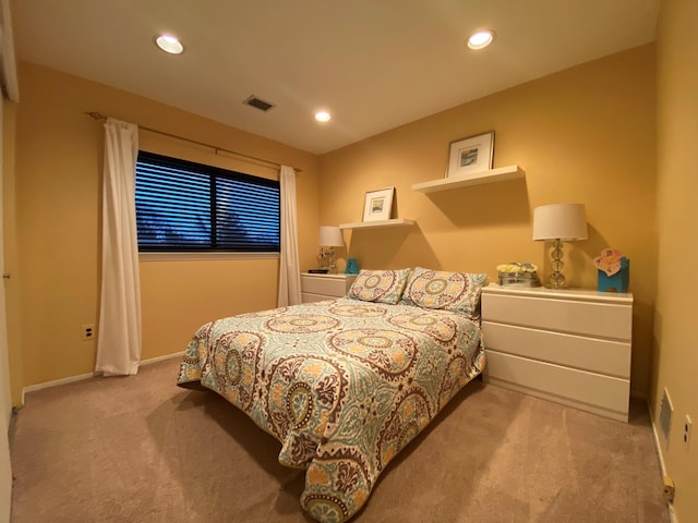 bedroom with recessed lighting, visible vents, baseboards, and light colored carpet