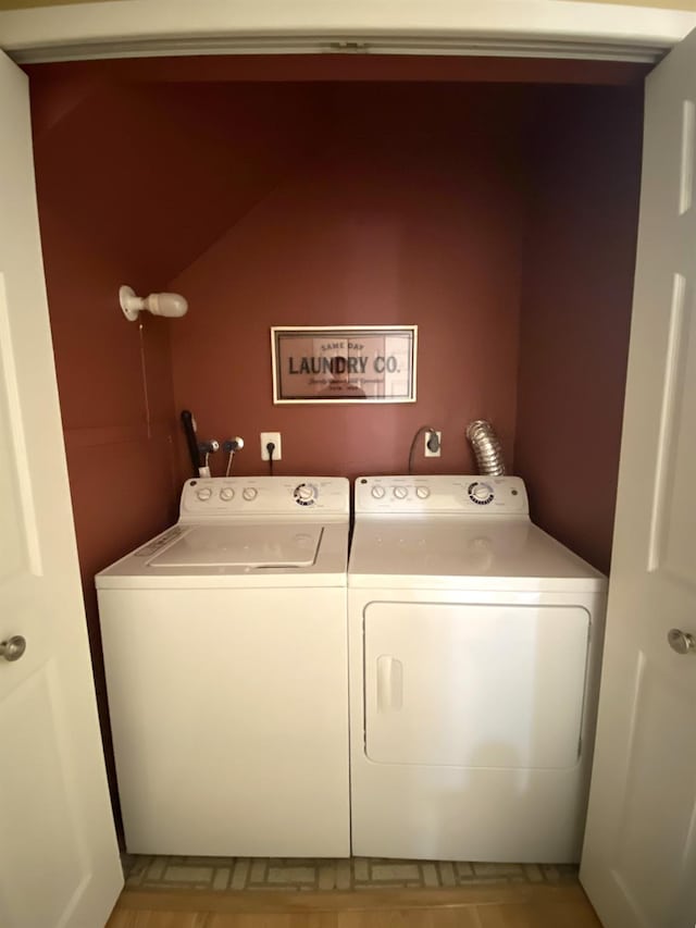 clothes washing area featuring laundry area and independent washer and dryer