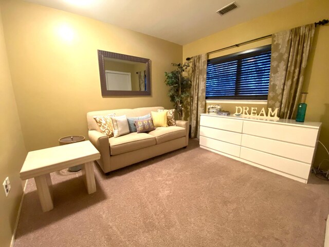 unfurnished room featuring visible vents and carpet flooring