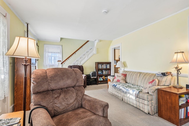 carpeted living area with crown molding and stairway