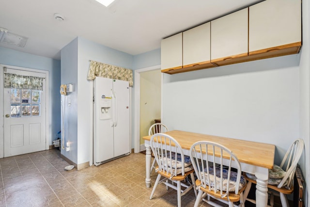 dining space with baseboards