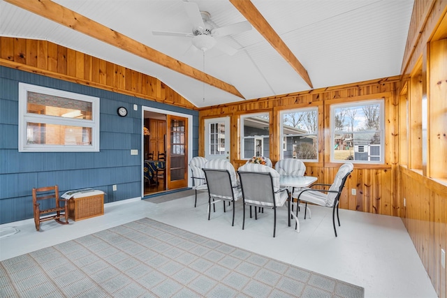 sunroom with lofted ceiling with beams and ceiling fan