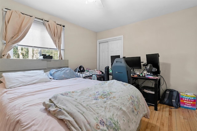 bedroom featuring wood finished floors and a closet