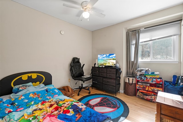 bedroom with ceiling fan and wood finished floors