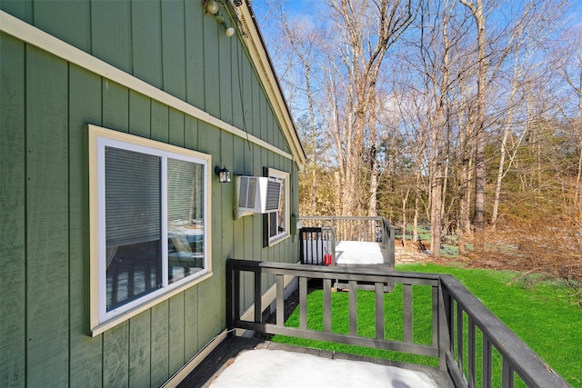 deck featuring a lawn and a wall unit AC