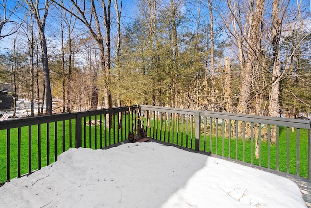 wooden deck with a lawn and a patio