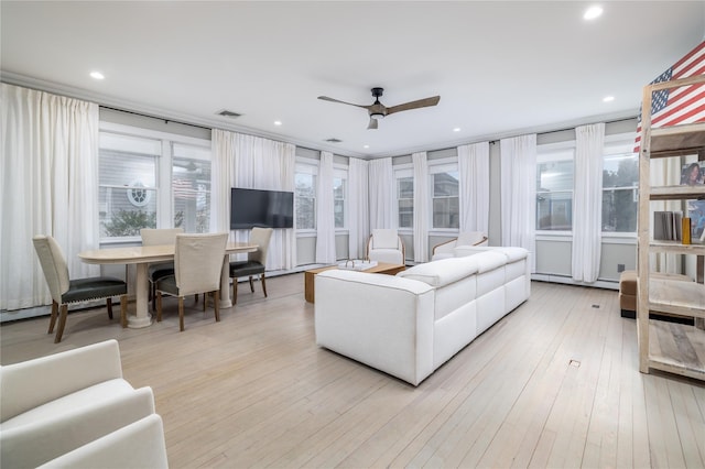 living room with light wood finished floors, recessed lighting, visible vents, and a ceiling fan