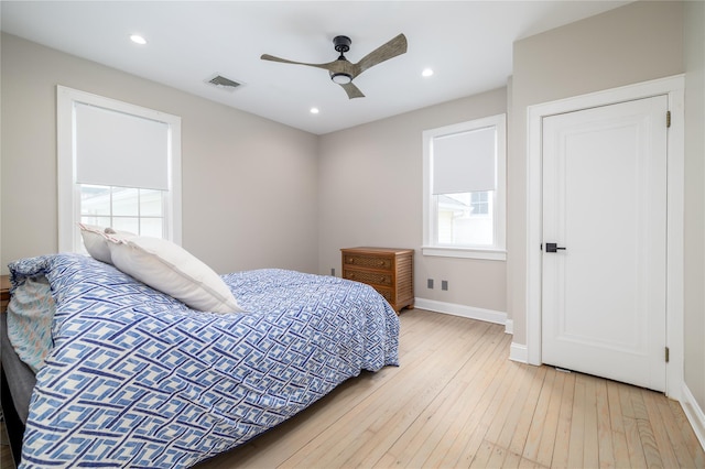 bedroom with visible vents, baseboards, light wood-style flooring, ceiling fan, and recessed lighting