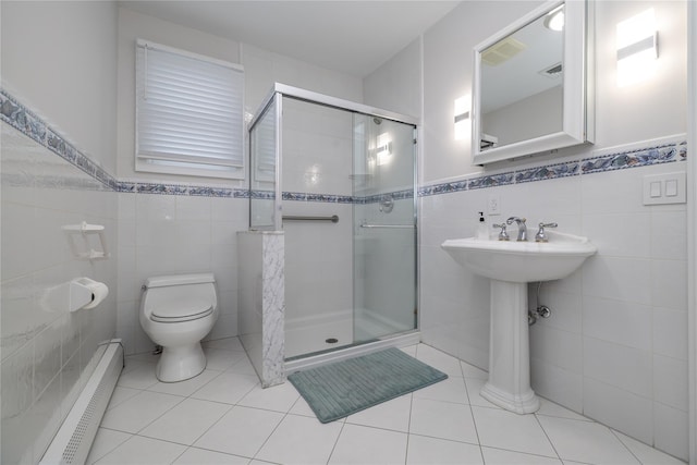 bathroom with toilet, a stall shower, tile patterned flooring, and a baseboard heating unit