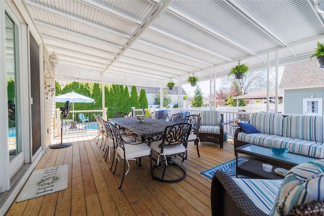 deck featuring an outdoor living space and outdoor dining space