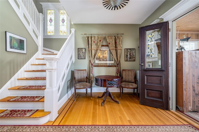 interior space featuring stairway, baseboards, and wood finished floors