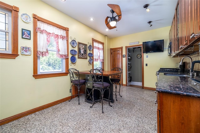 dining room featuring ceiling fan, baseboards, light colored carpet, and recessed lighting