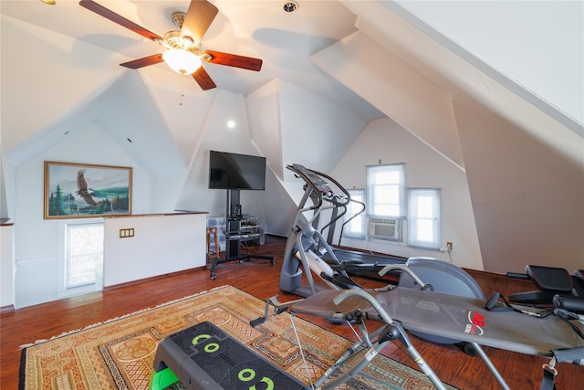 exercise room with lofted ceiling and wood finished floors