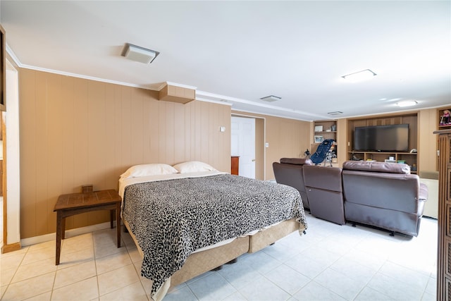 bedroom featuring light tile patterned floors, visible vents, and crown molding