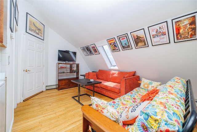 living room with lofted ceiling with skylight, light wood-type flooring, and baseboard heating