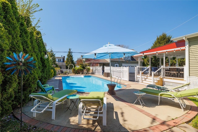 view of pool featuring a fenced in pool, a patio, and fence