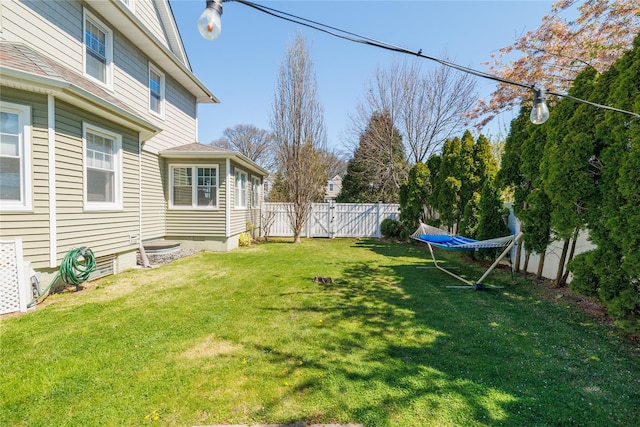 view of yard with a fenced backyard